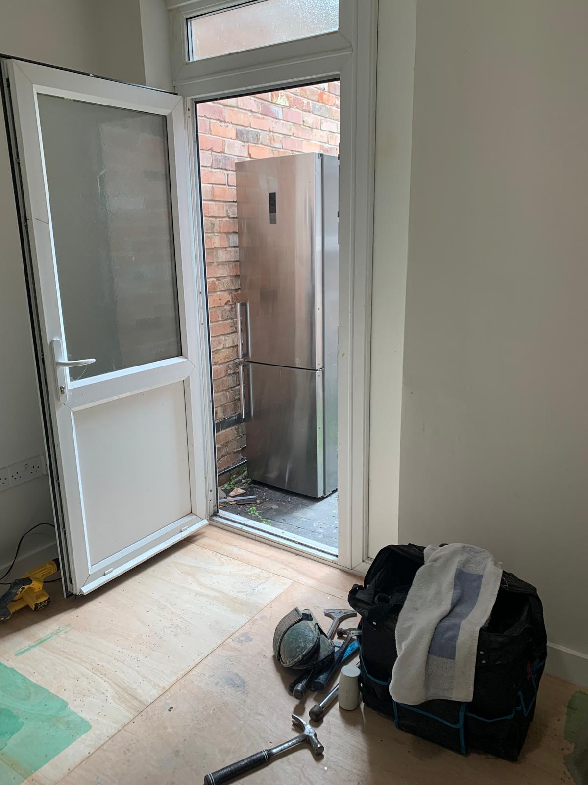 Bulky appliance removal through tight alleyways and doorways